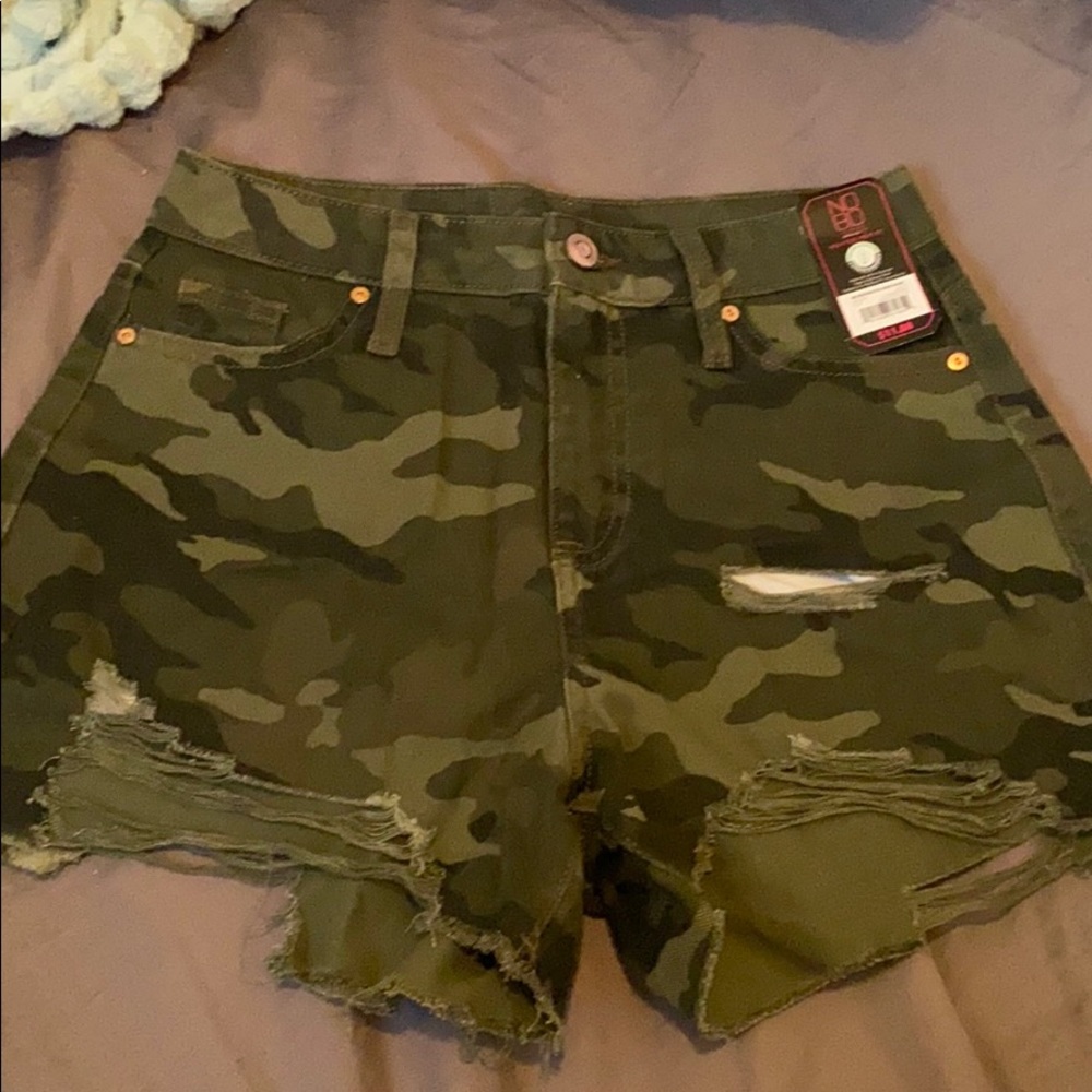 Distressed camo shorts